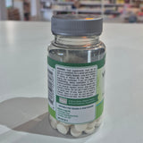 Bottle of dietary supplements with a label on a white surface