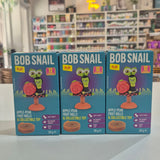 Three Bob Snail toy boxes with colorful packaging on a shelf.