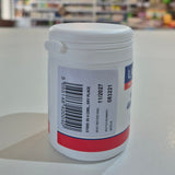 White container with a label featuring a barcode on a white surface.
