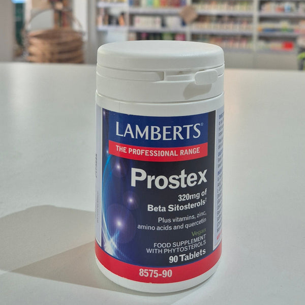Lamberts Prostex supplement container on a table with a blurred background