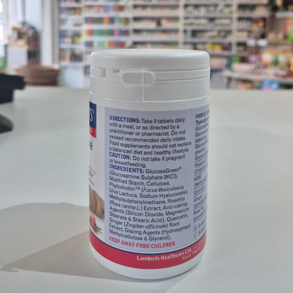 Supplement bottle with label showing directions and ingredients on a store shelf background