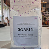 Packaging of Soakin magnesium flakes with a blurred store background