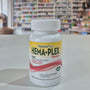 Bottle of Natures Plus Hema-Plex Tablets 42mg Elemental Iron, 30 capsules on a white surface with a blurred indoor background.