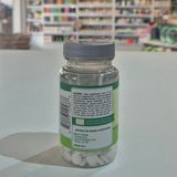 Bottle of supplements with a label on a counter in a store setting