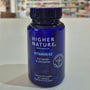 Blue bottle of Higher Nature Vitamin K2 on a light surface with a blurred background