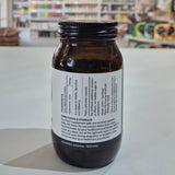Bottle with label on a white surface with a blurred background