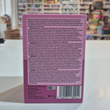 Purple Hunter & Gather supplement package with 'Restore' and 'Mixed Berry' text on a blurred indoor background. 