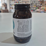 Bottle of Viridian Extra C supplement on a white surface with a blurred background.