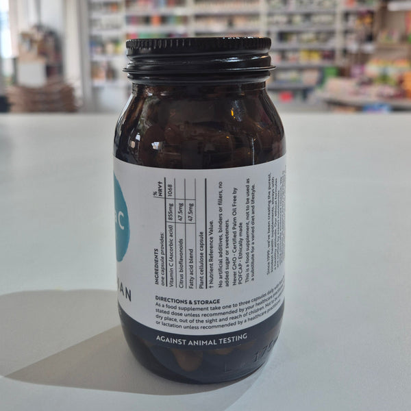Bottle of Viridian Extra C supplement on a white surface with a blurred background.