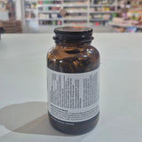 Bottle of Viridian Co-Q10 & MCT supplement on a shelf with a blurred store background