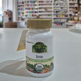 A bottle of Nature's Plus Source of Life Garden Iron, certified organic iron whole food grown, with the USDA organic seal displayed in a store setting