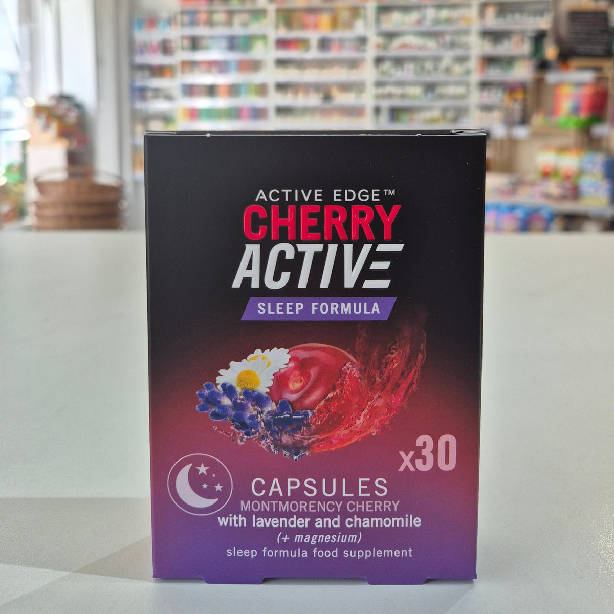 CherryActive Sleep Formula supplement packaging on a shelf with a blurred store background