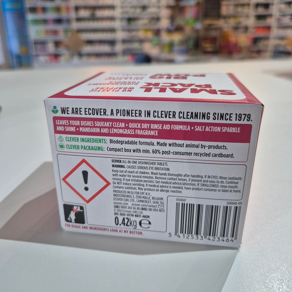 Dishwasher tabs. Product packaging with a label and barcode on a shelf in a store.