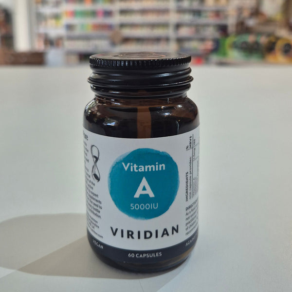 Vitamin A supplement bottle with Viridian label on a table in a store setting