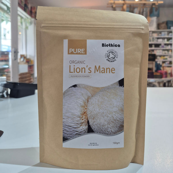 Organic Lion's Mane Mushroom powder on a white surface