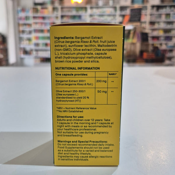Yellow box with text on a white surface with a blurred background