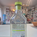 Bottle with a green cap and label in a store setting