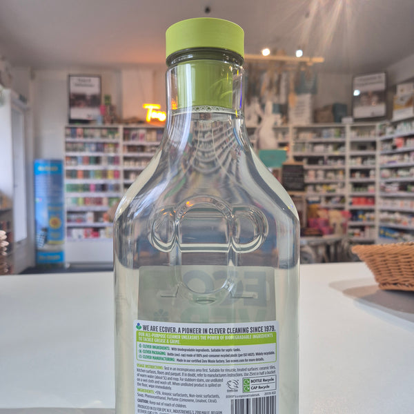 Bottle with a green cap and label in a store setting