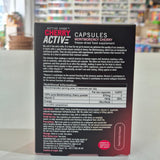 Close-up of a supplement capsule container with text on a blurred background