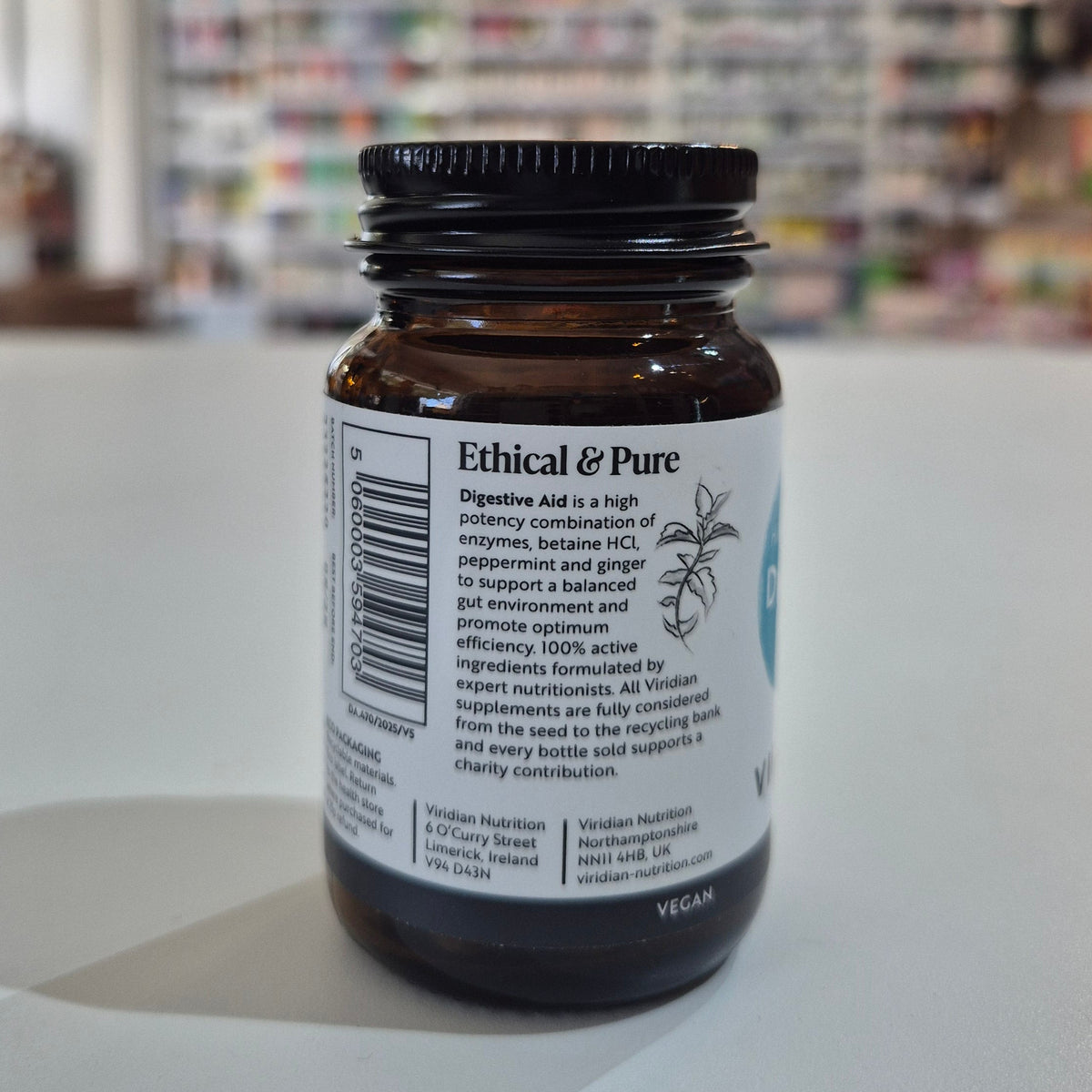 Brown supplement bottle with 'Ethical & Pure' label on a white surface