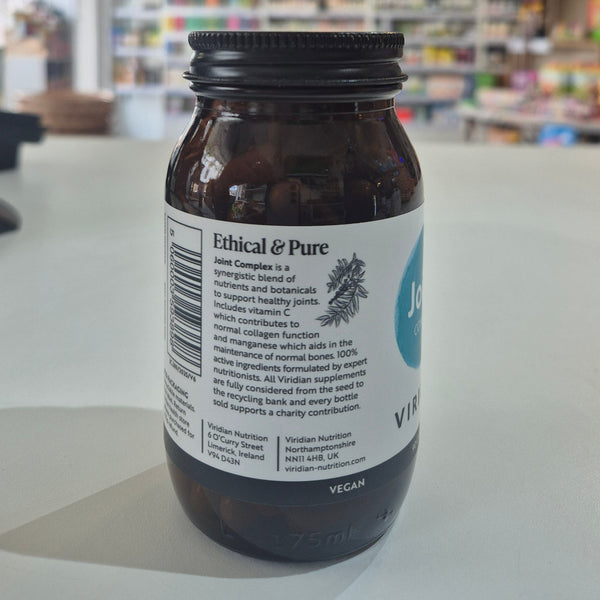 Bottle of 'Ethical & Pure' Viridian supplement with a label on a blurred store background