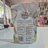Biona organic coconut water packaging on a white surface with a blurred indoor background