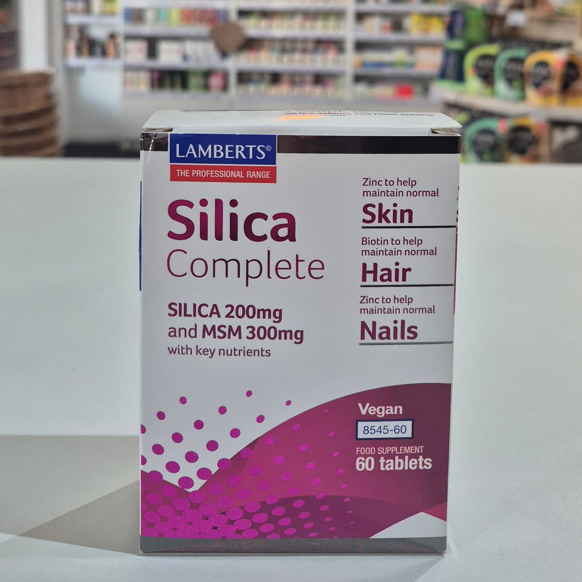 Box of Lamberts Silica Complete supplement on a counter with a store background
