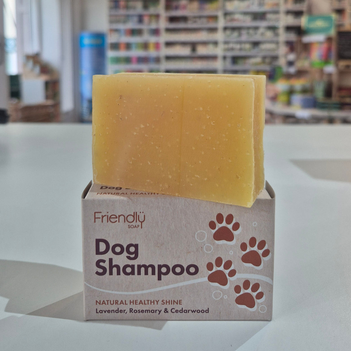 Bar of soap and box labeled 'Dog Shampoo' in a store setting