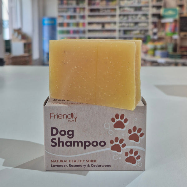 Bar of soap and box labeled 'Dog Shampoo' in a store setting