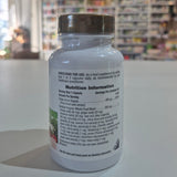 Supplement bottle with nutrition information label on a blurred store shelf background