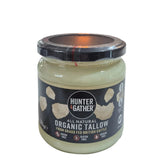 Jar of organic tallow on a white surface with a blurred background