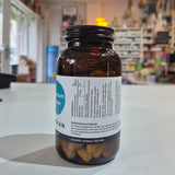 Bottle of Viridian Magnesium Taurate on a counter in a store setting. Brown supplement bottle with label on a white surface, blurred store background