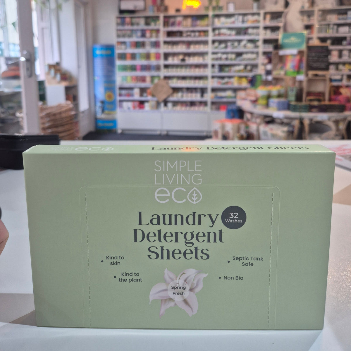 Box of Simple Living Eco laundry detergent sheets in a store setting