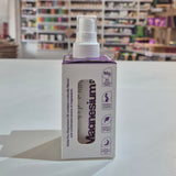 Box of Magnesium product on a table with shelves in the background