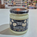 Jar of organic Hunter & Gather all-natural Organic Tallow on a white surface with a blurred background