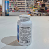 White bottle with label in front of a blurred store interior