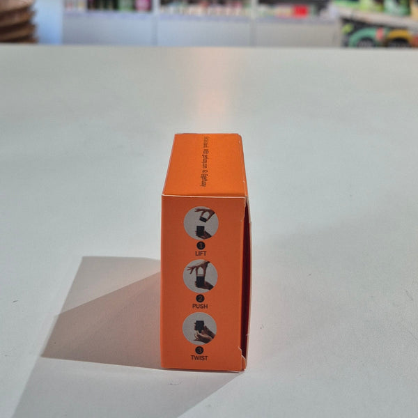Orange box with instructions on a gray surface