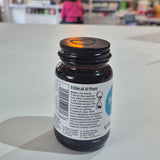 Bottle of Viridian Biotin on a white surface with a blurred store interior in the background. Bottle labeled 'Ethical & Pure' on a light surface with blurred background