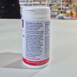 Vitamin supplement container with label on a table in a store setting