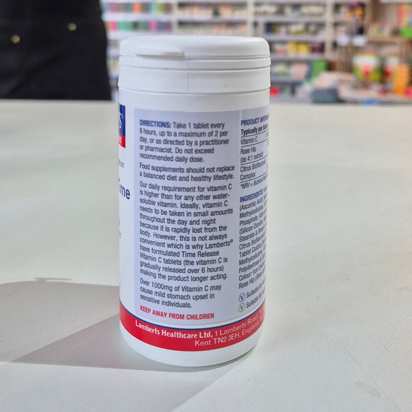 Vitamin supplement container with label on a table in a store setting