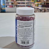 Bottle of vitamins on a counter with a blurred store interior in the background