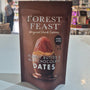 Packaged snack with 'Forest Feast' branding on a counter in a store.