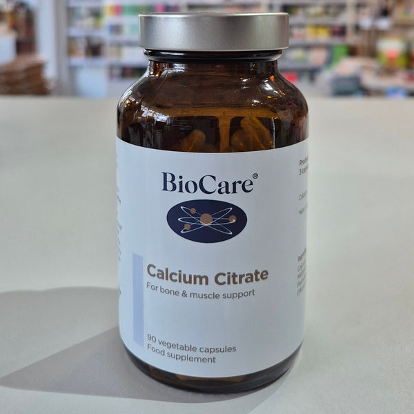 A bottle of Biocare Calcium Citrate containing 90 capsules for bone and muscle support in a shop on the counter