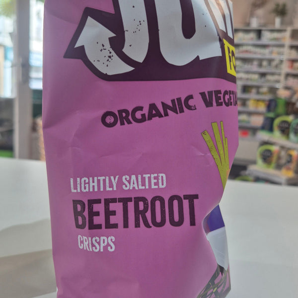 Purple bag of organic beetroot crisps with visible branding in a store setting