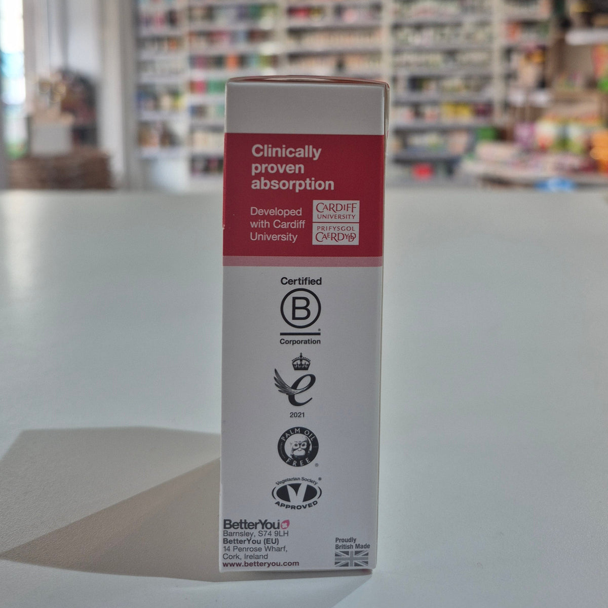 Product packaging with visible branding in a store setting