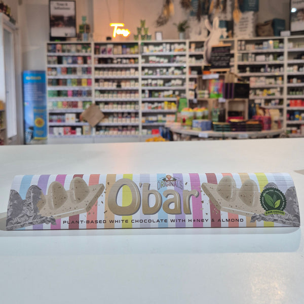 Chocolate bar with a colourful surfboard design and various items on shelves.