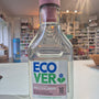 Bottle of Eco Ver on a white surface with a blurred background