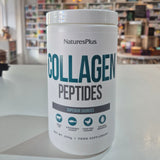 NaturesPlus Collagen Peptides container on a counter with a store background