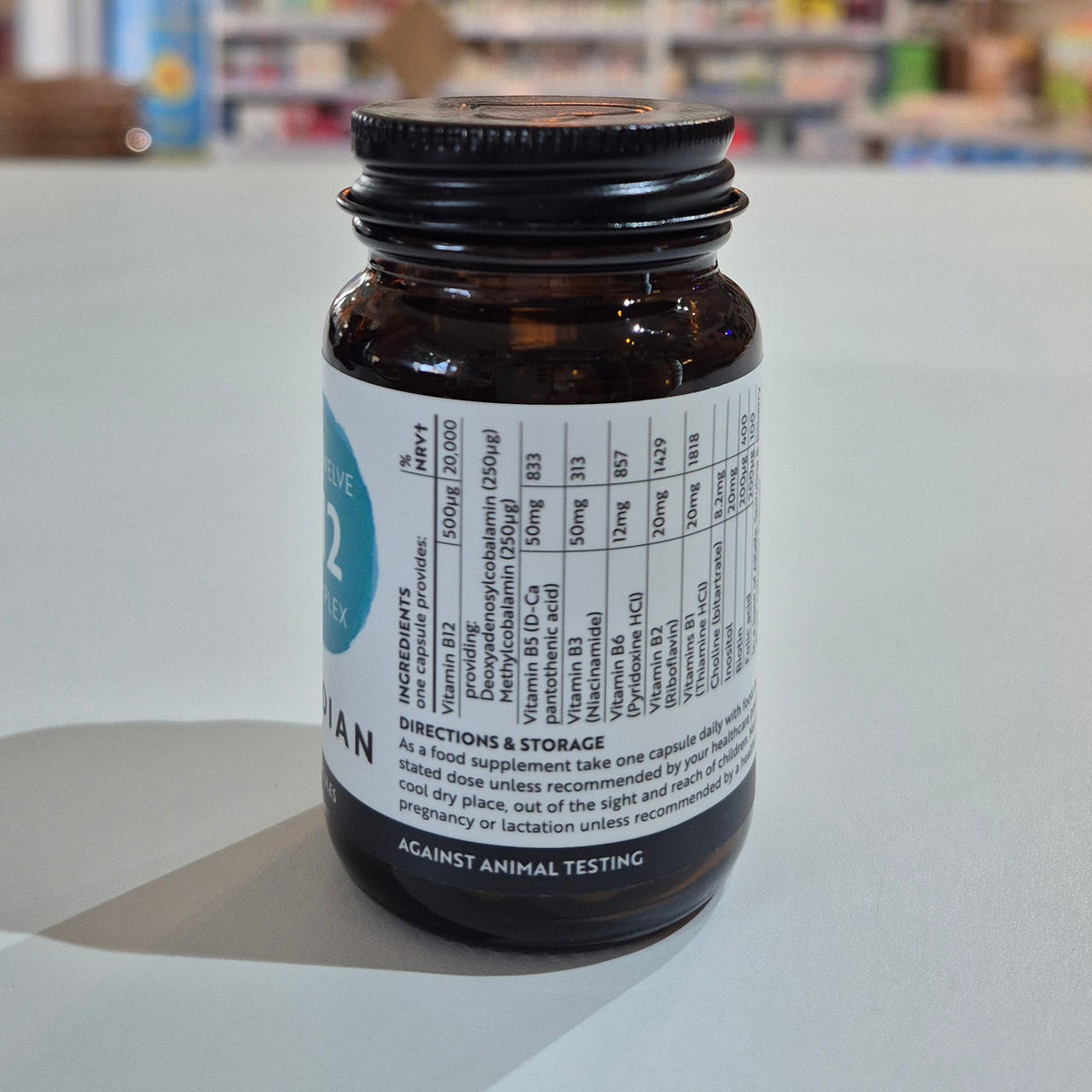 Supplement bottle with label on a light surface
