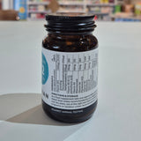 Supplement bottle with label on a light surface